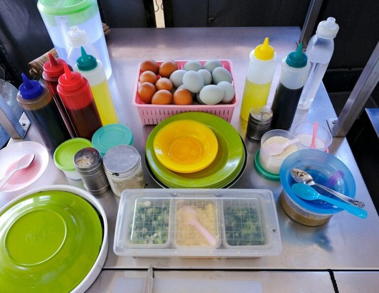 Organized food-preparation station with eggs, sauces, plates, and ingredients
